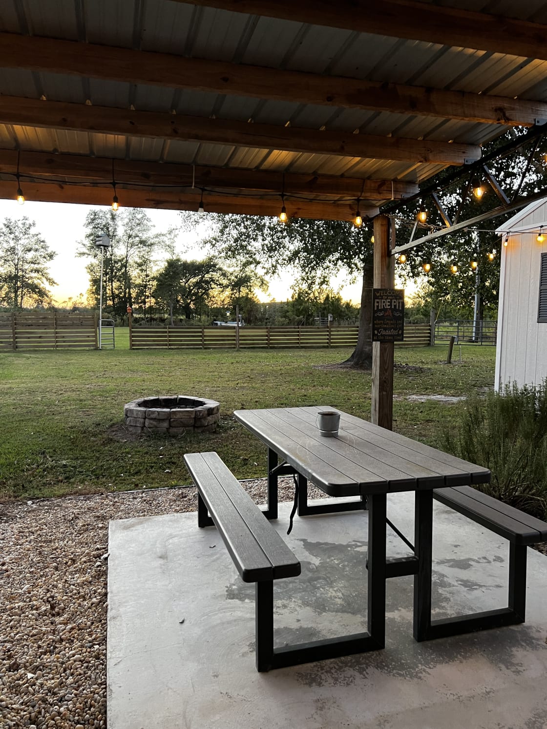 view of picnic table and fire pit