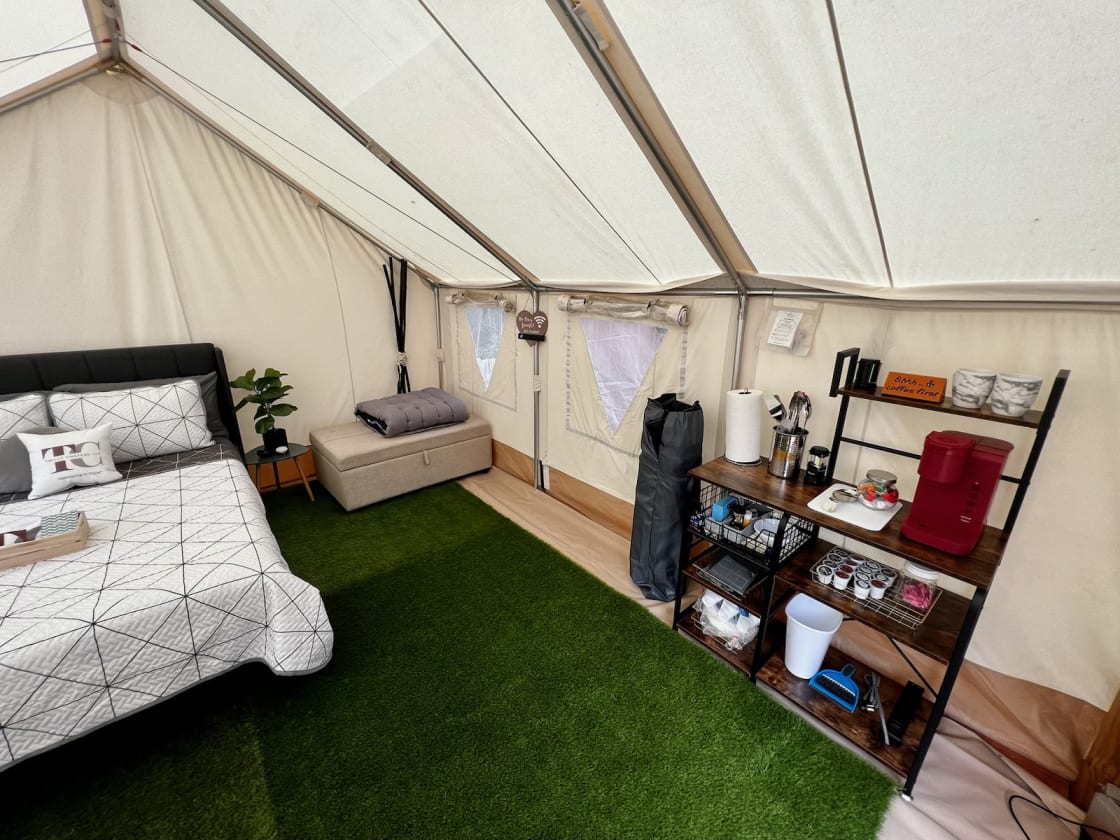 Glamping tent with queen size bed and pull out couch sleeps 4