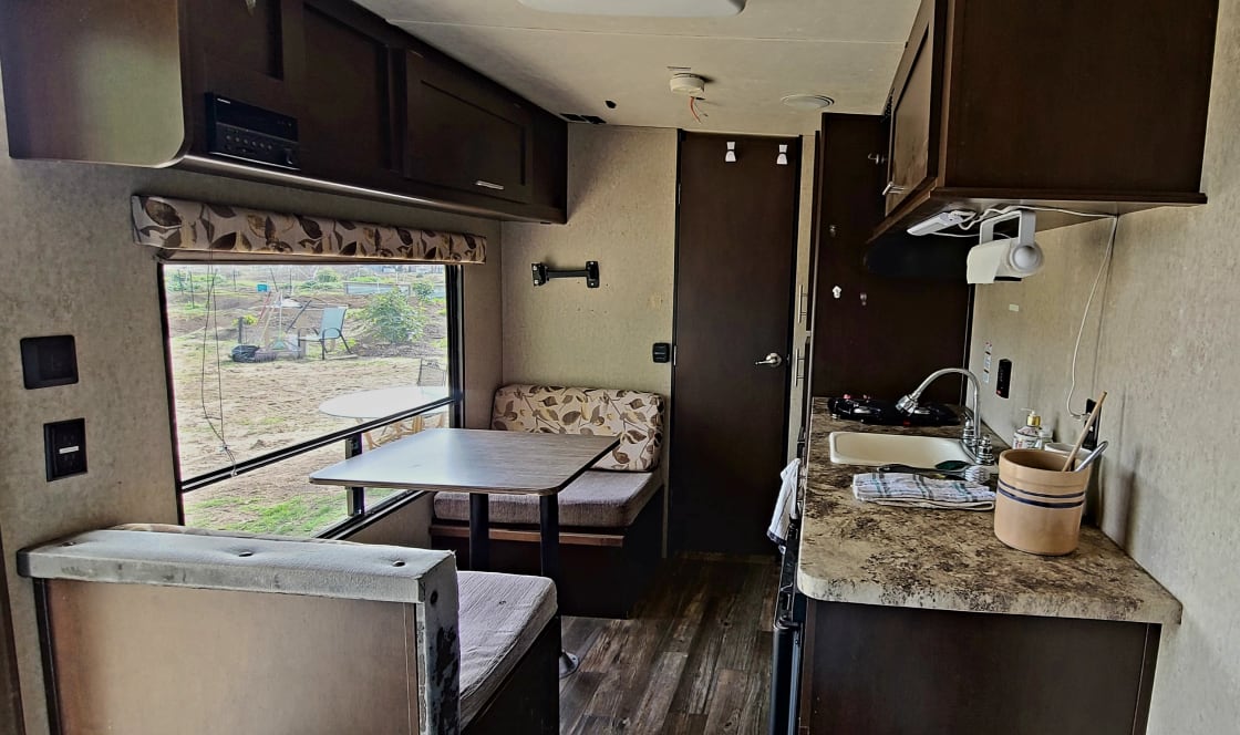 The Cozy Camper @Hill Horizon provides a quaint dining area for 2 and basic supplies.