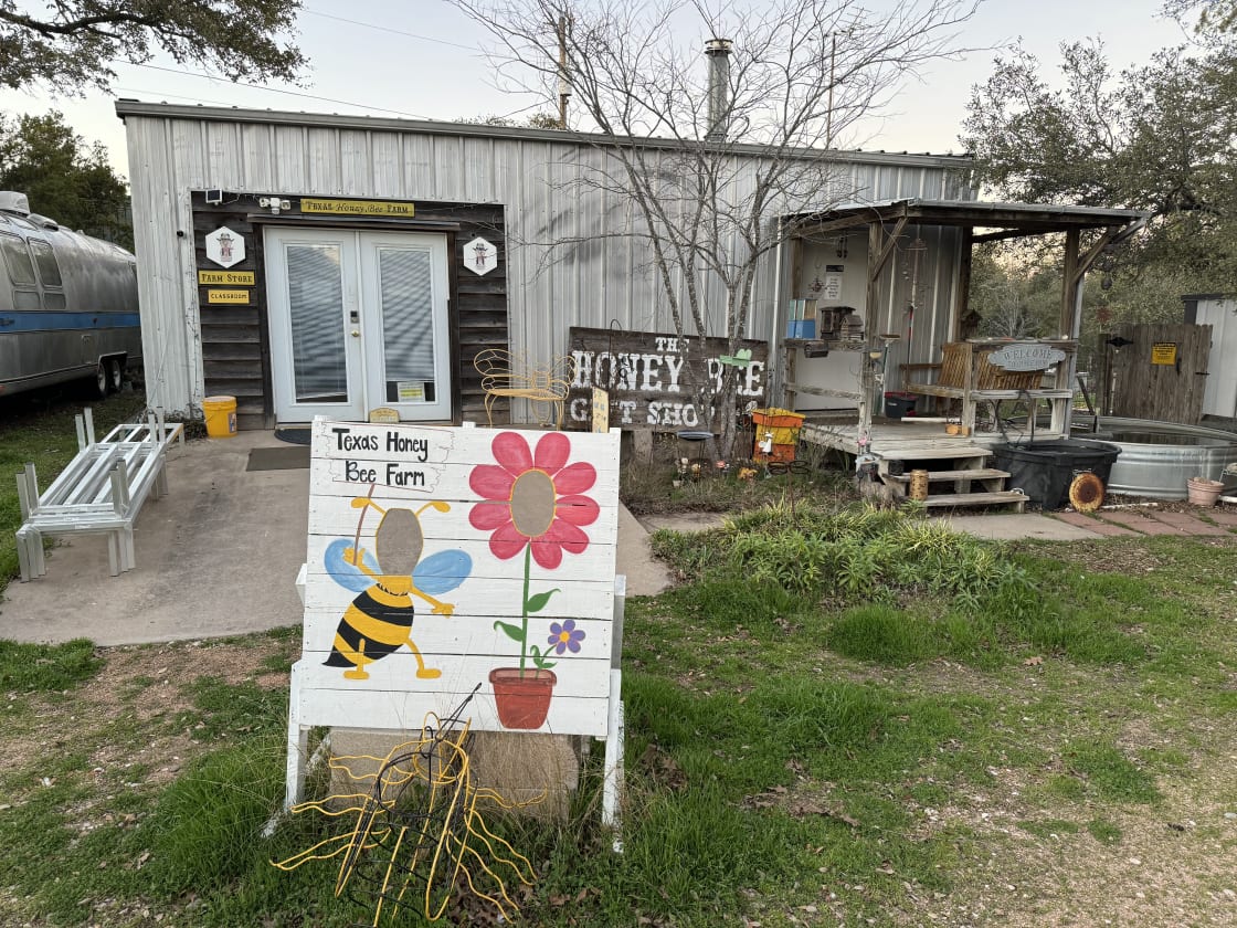 Here is the Honey Bee Store. Restroom is on the right hand side up the steps.