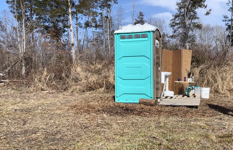 Porta potty for privacy. Hand wash sink