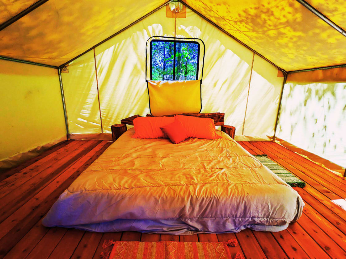 Real king bed inside the Sarabi tent.