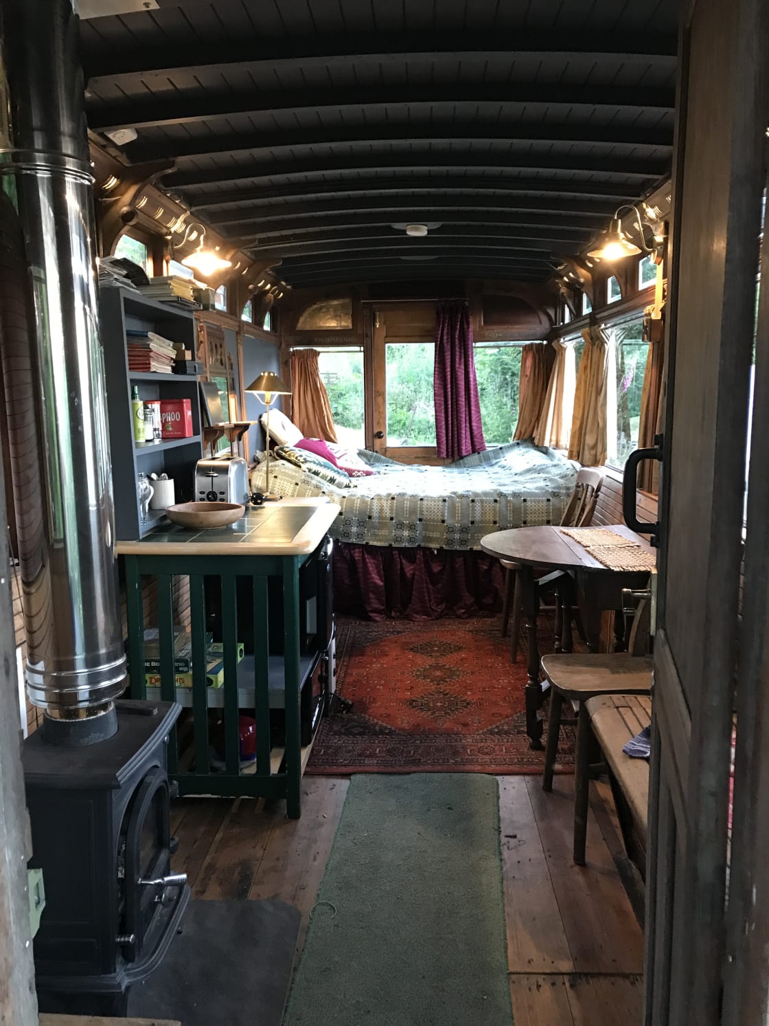 Inside Tram, comfy Bed, indoor seating/kitchen area, Silk Curtains, Historic  interior with opening quarter lights, LED lights behind Air Vents.