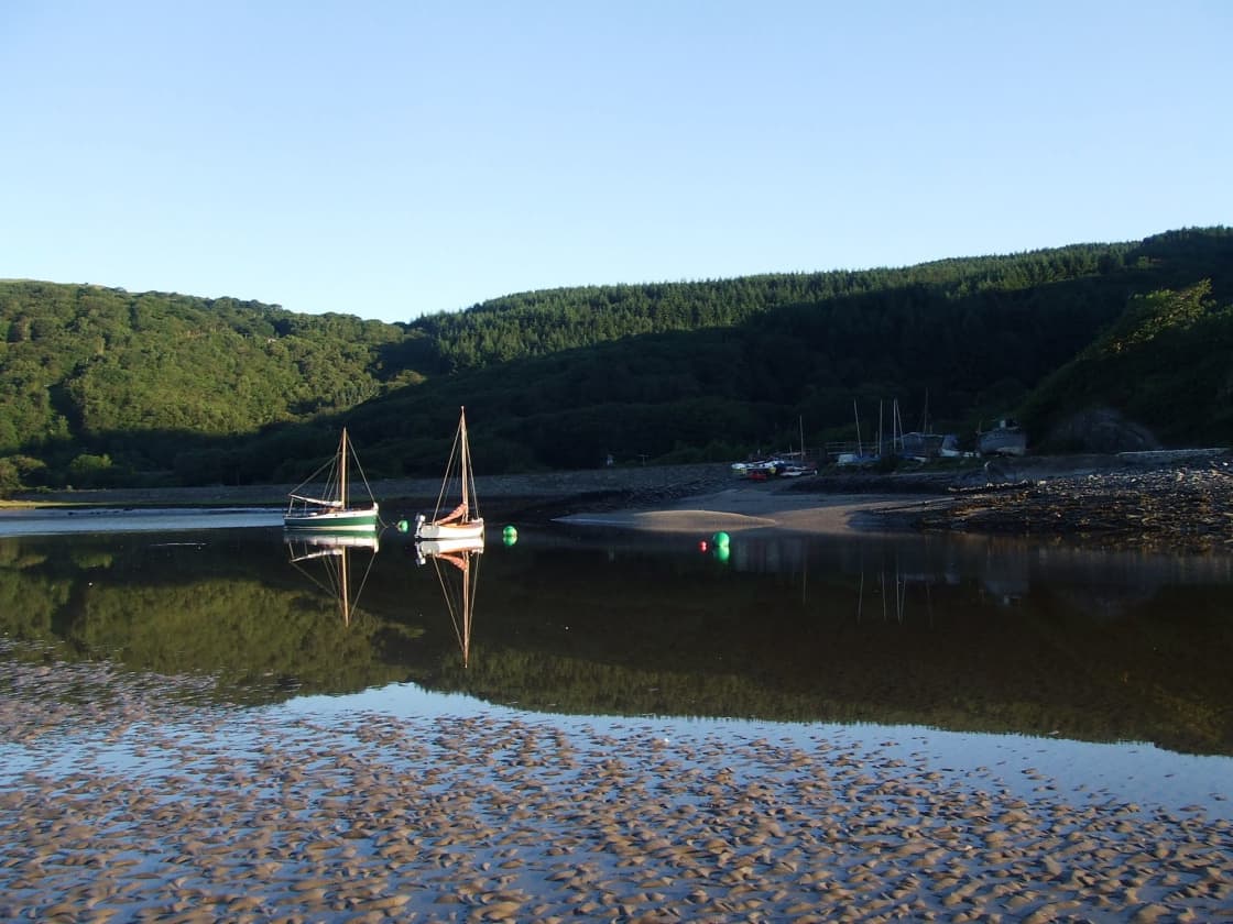 Camping and rustic glamping in a working boatyard with an exceptional location on the Dyfi estuary.