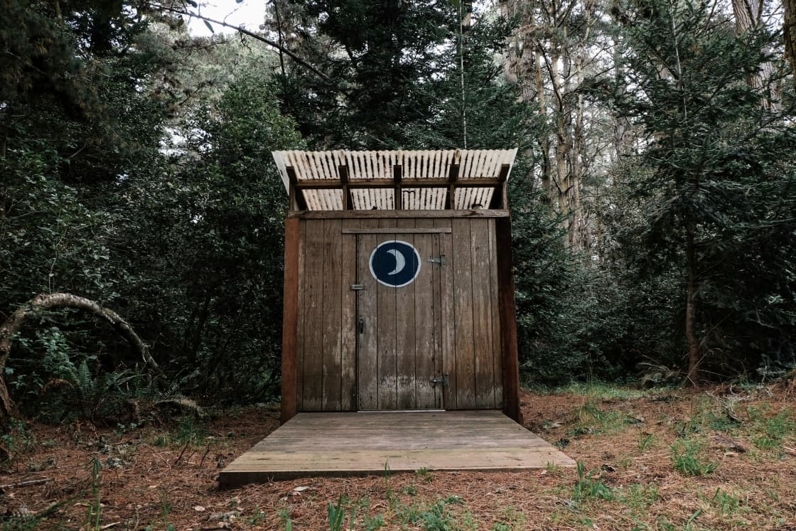 The camper's outhouse. At night, the solar garden stake lights help you find your way. 