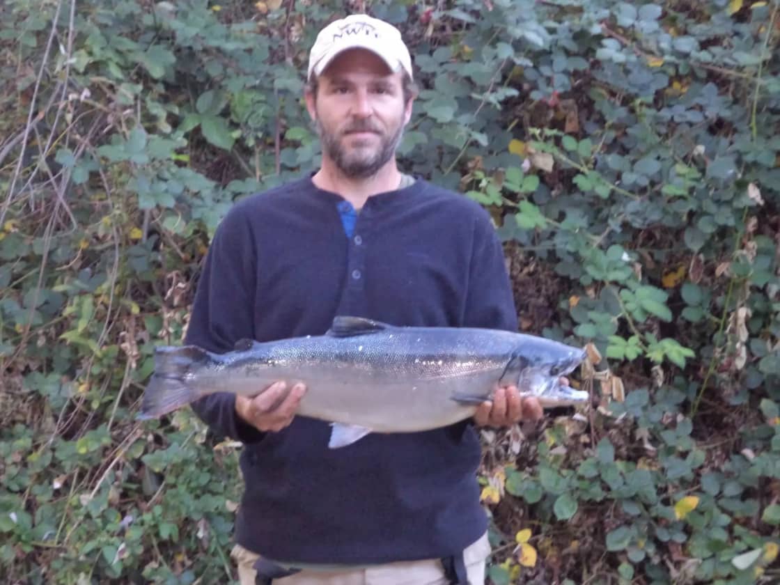 Joe with a salmon he caught at Otter Space from the shore of the Klamath River
