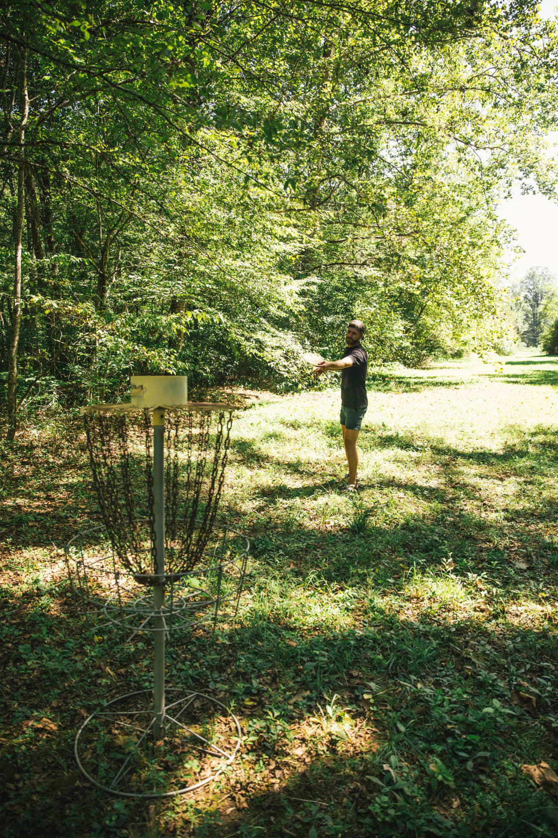 Disc golf along the field next to the trout stream