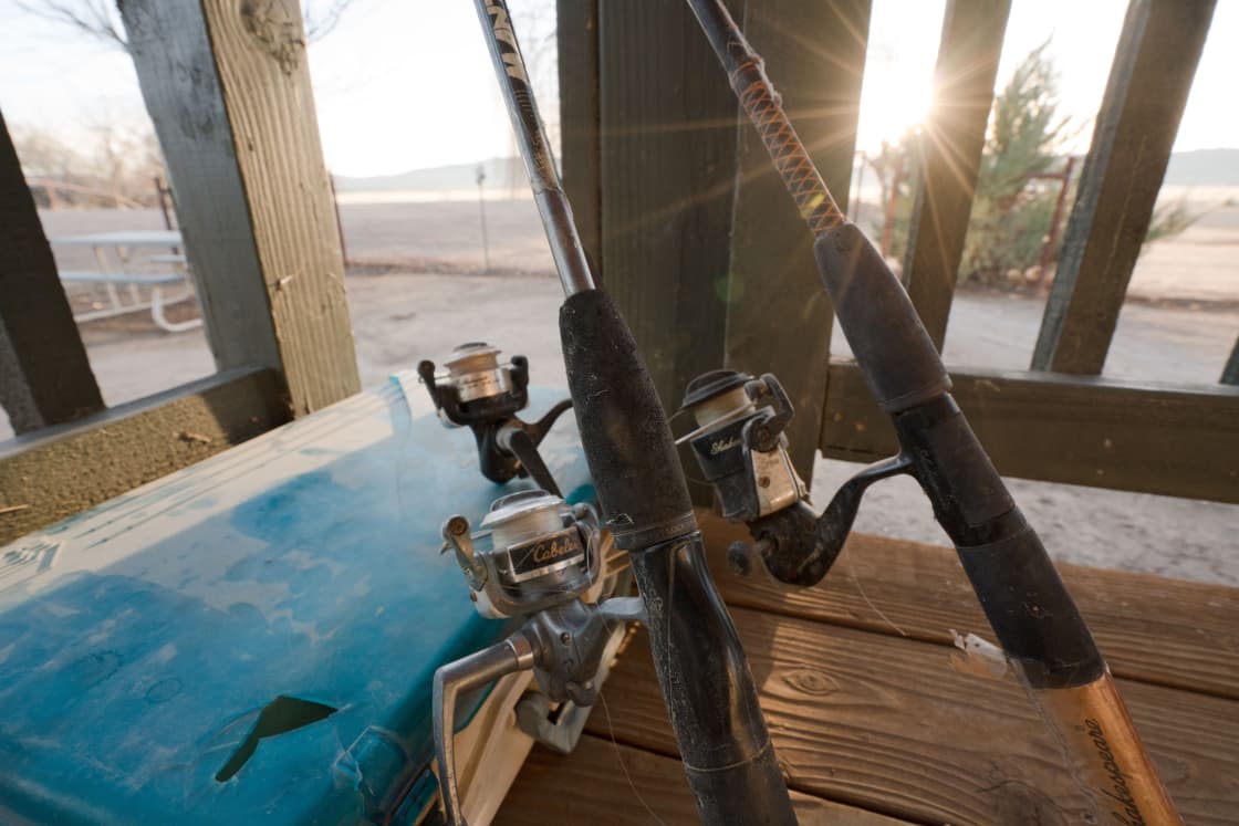 The bunkhouse is equipment with fishing rods for the bass and bluegill pond