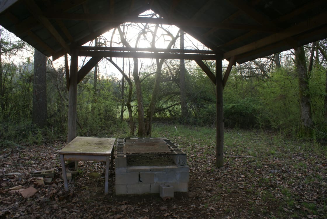 Shelter with large grill and table.
