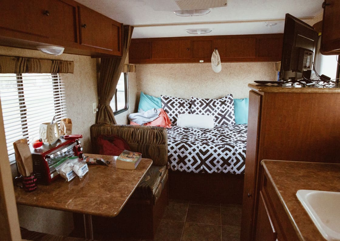 kitchen dinette and full-sized bed
