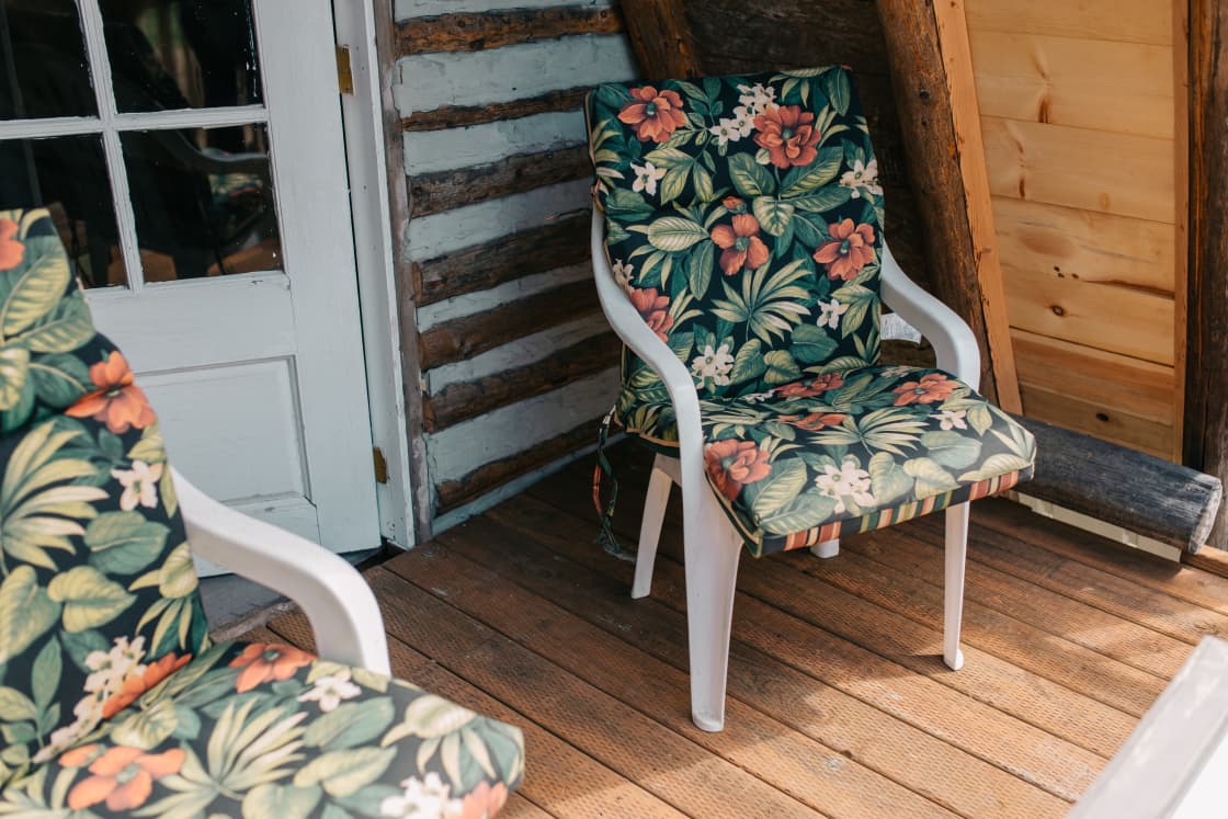 Two chairs and a table fit perfectly on the porch