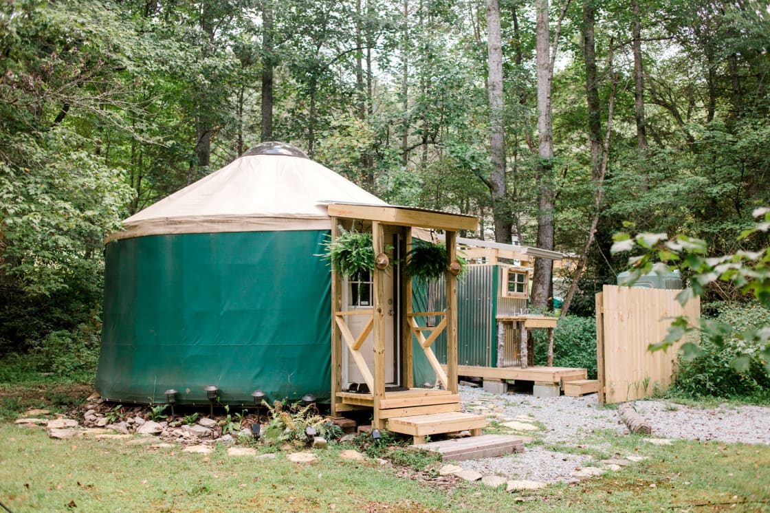 Looking out over all parts of the yurt property - with outdoor restroom and shower in the background
