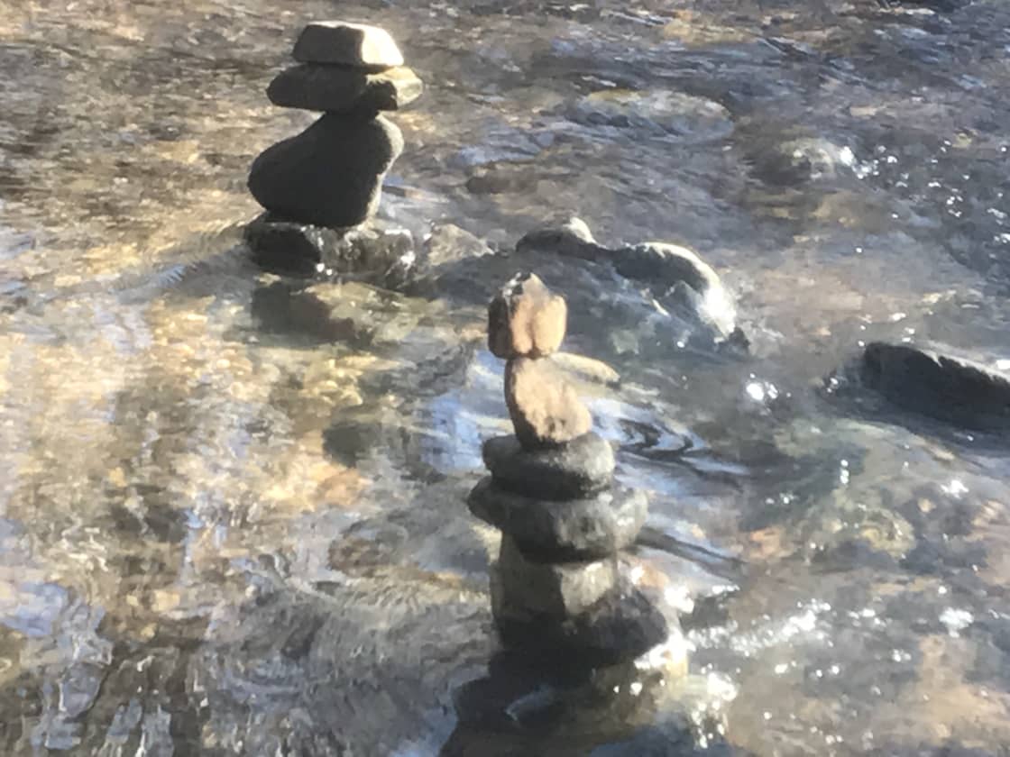 Play in our creek and balance some stones.
