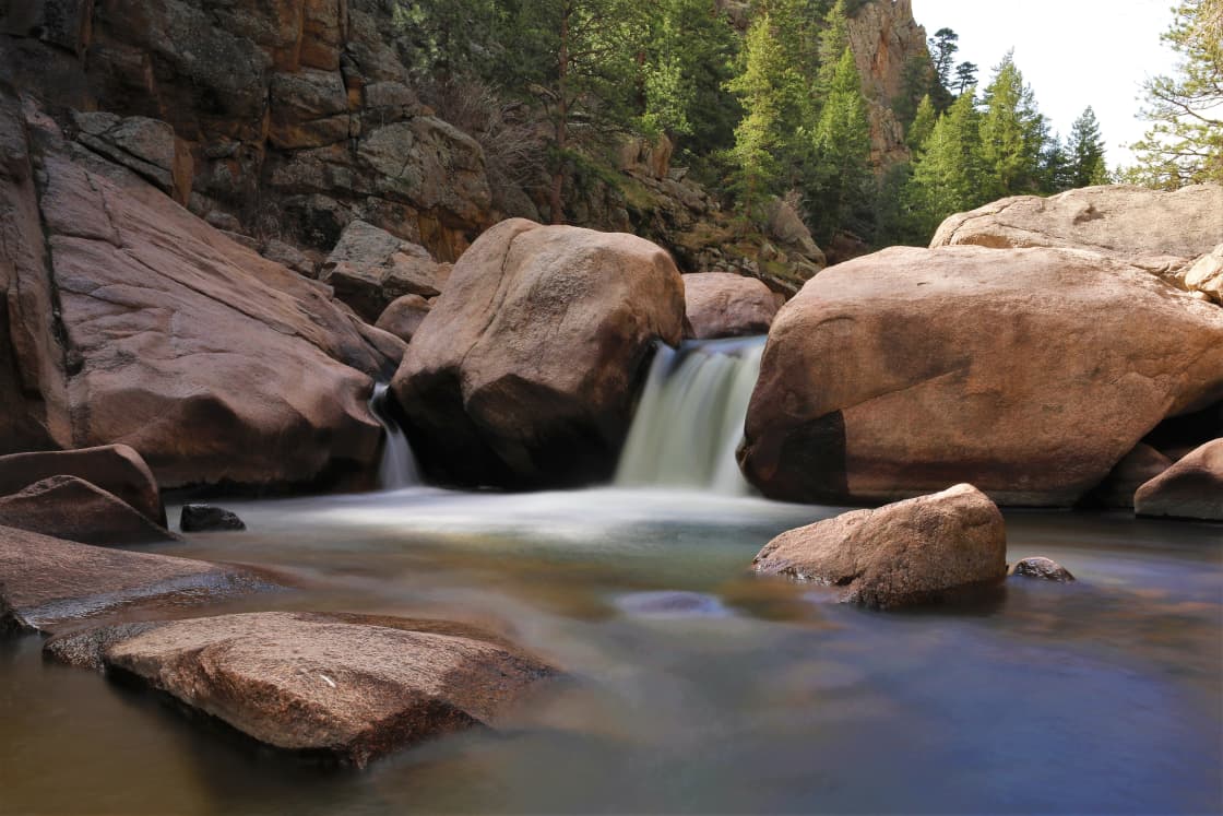 Enjoy the sound of a mountain stream and take a dip in the swimming hole a short walk from your camp site.