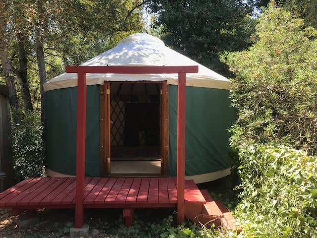 Yurt's exterior view located some 150 feet in seclusion from the house