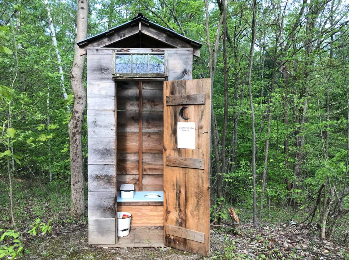 Outhouse with composting toilet is a five minute walk from your campsite.