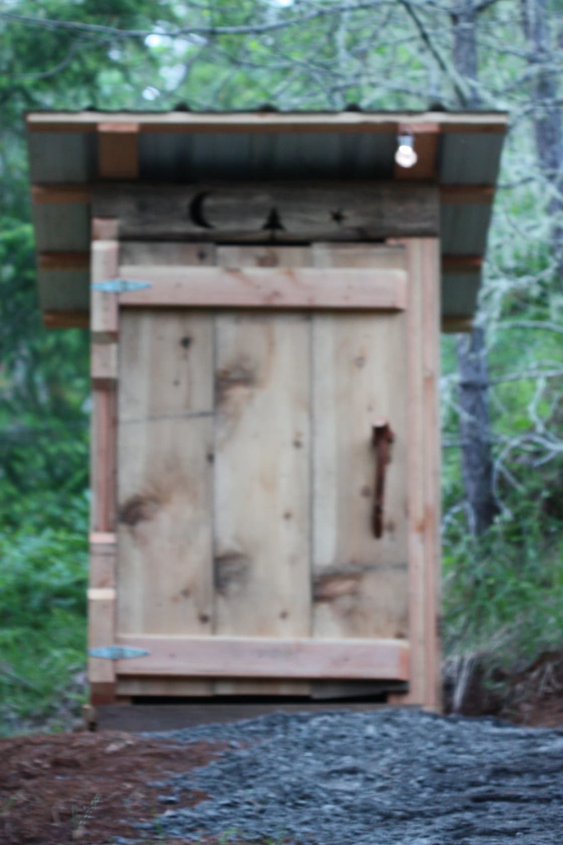 The outhouse is located between two sites.