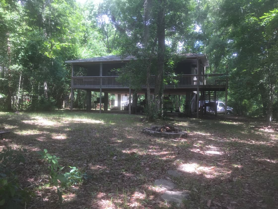 This 1500 Sq Ft 2 brm 1 bath open floor plan home is nestled within beautiful oak tree's on a high bluff directly on the Historic Suwannee River. 
