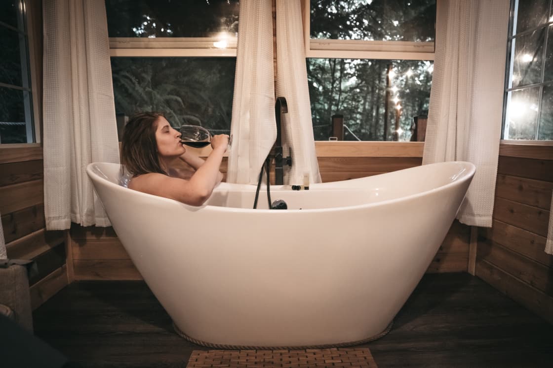 Enjoy a glass of wine while you soak in the tub