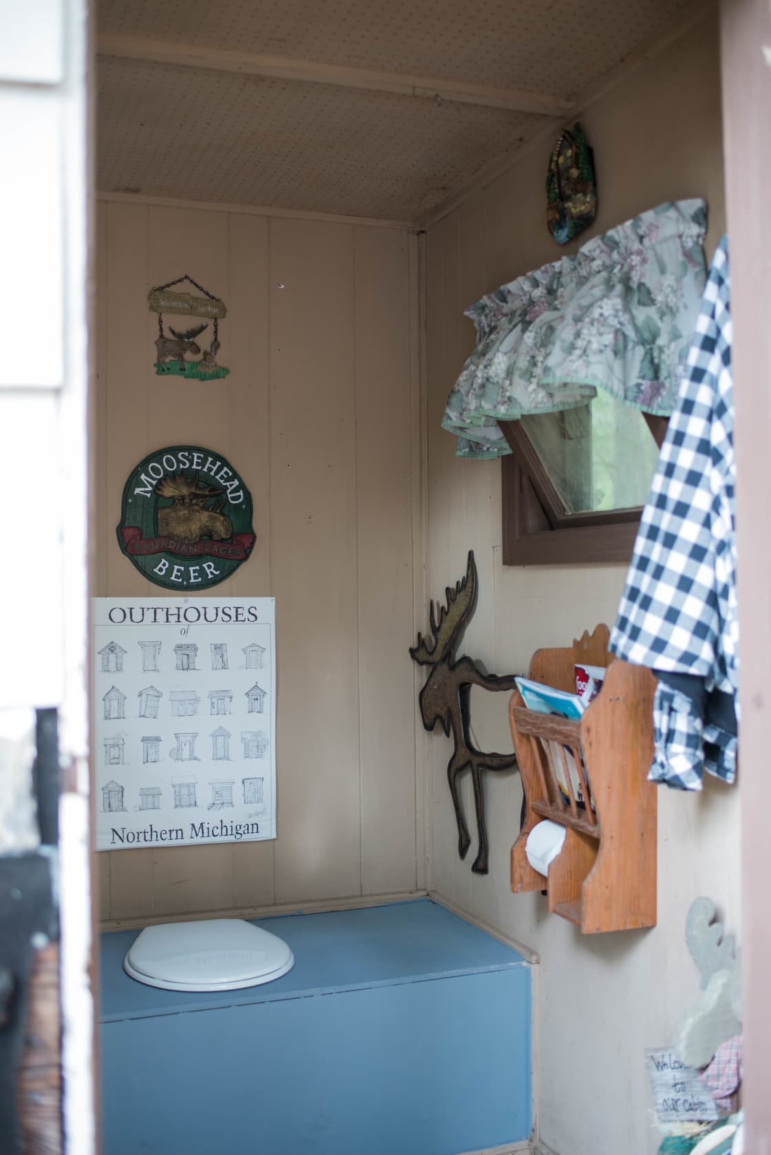 The inside of the outhouse is adorable! Judy did a fantastic job decking it out and making it so homey