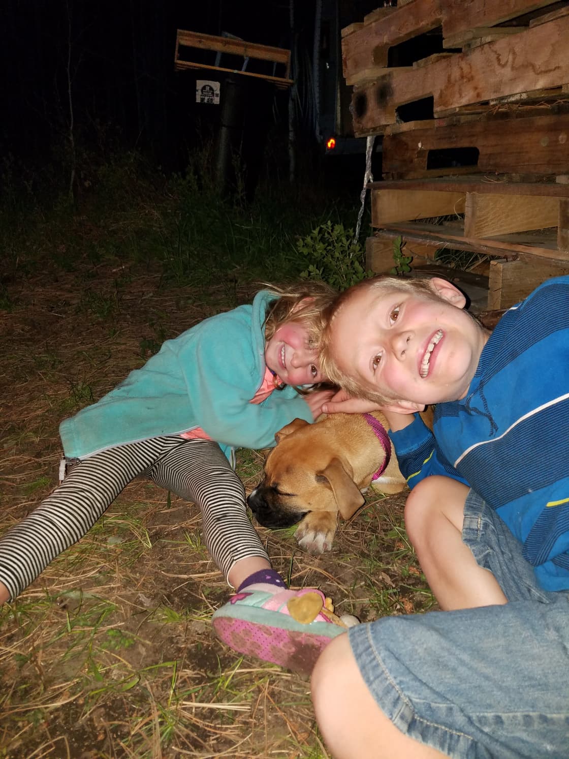 Getting ready for the campfire, snuggling up the pup.