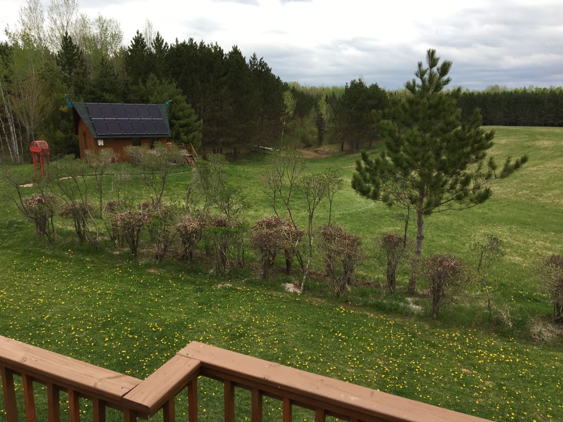 View of the cabin from our house deck. You will have privacy. It is halfway between our house and the pond.