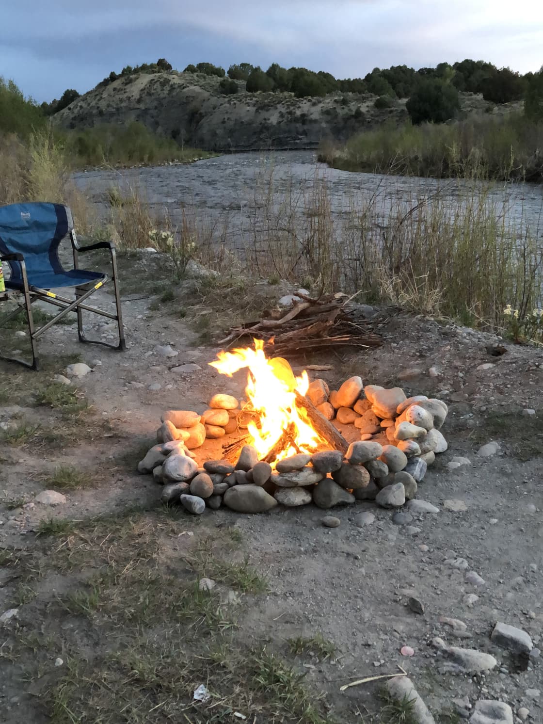 Camp fire on the river bank