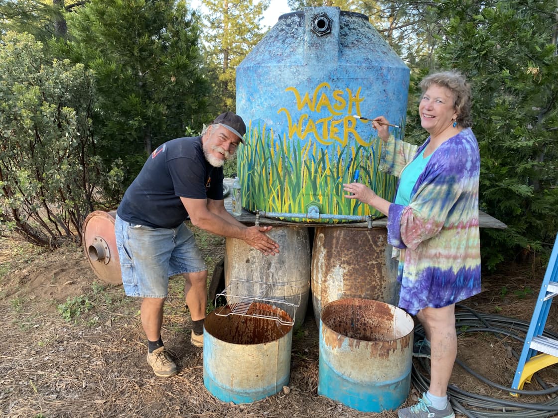 One of 2 wash/sanitize stations with land owner Pamela Quyle and Michel.