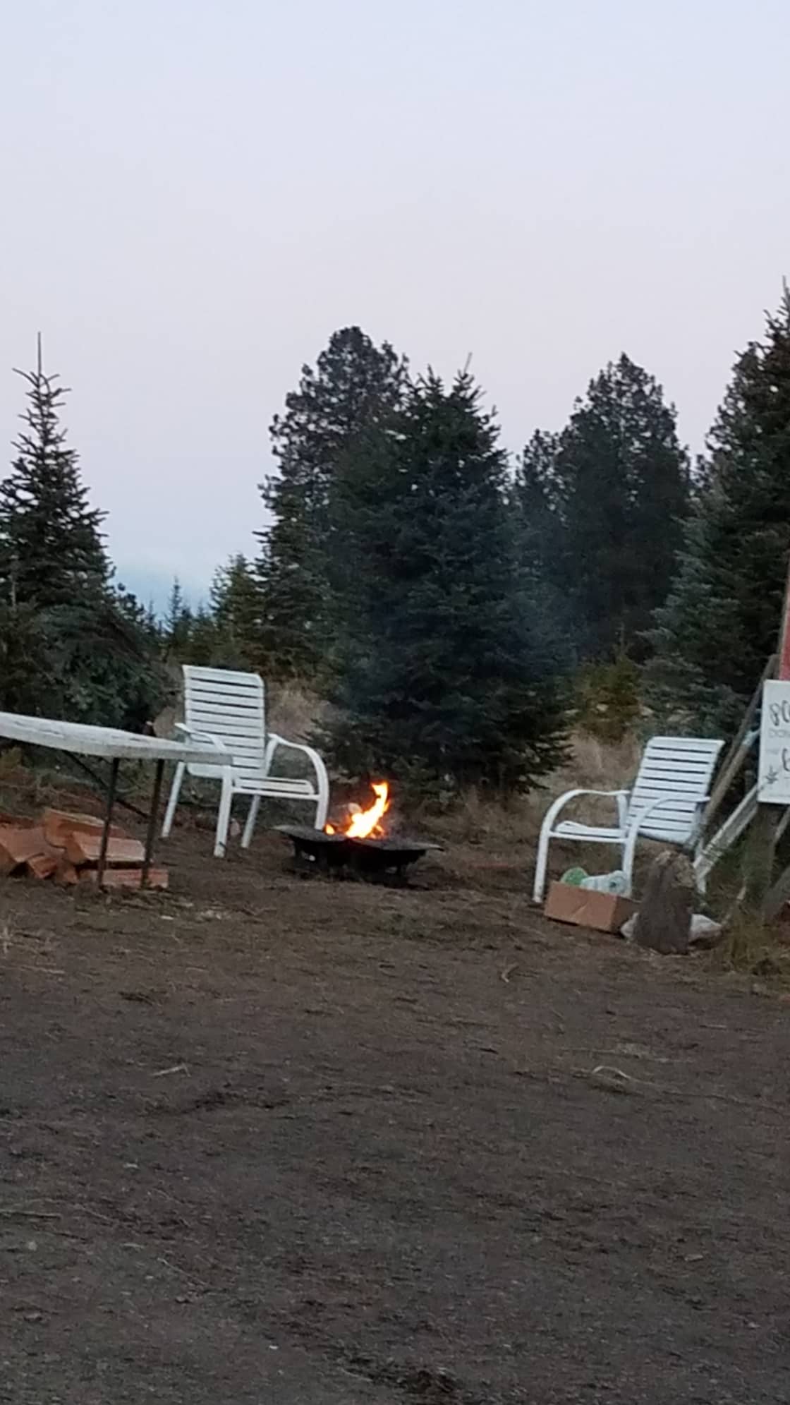 A peaceful campfire in the quiet of evening on the farm
