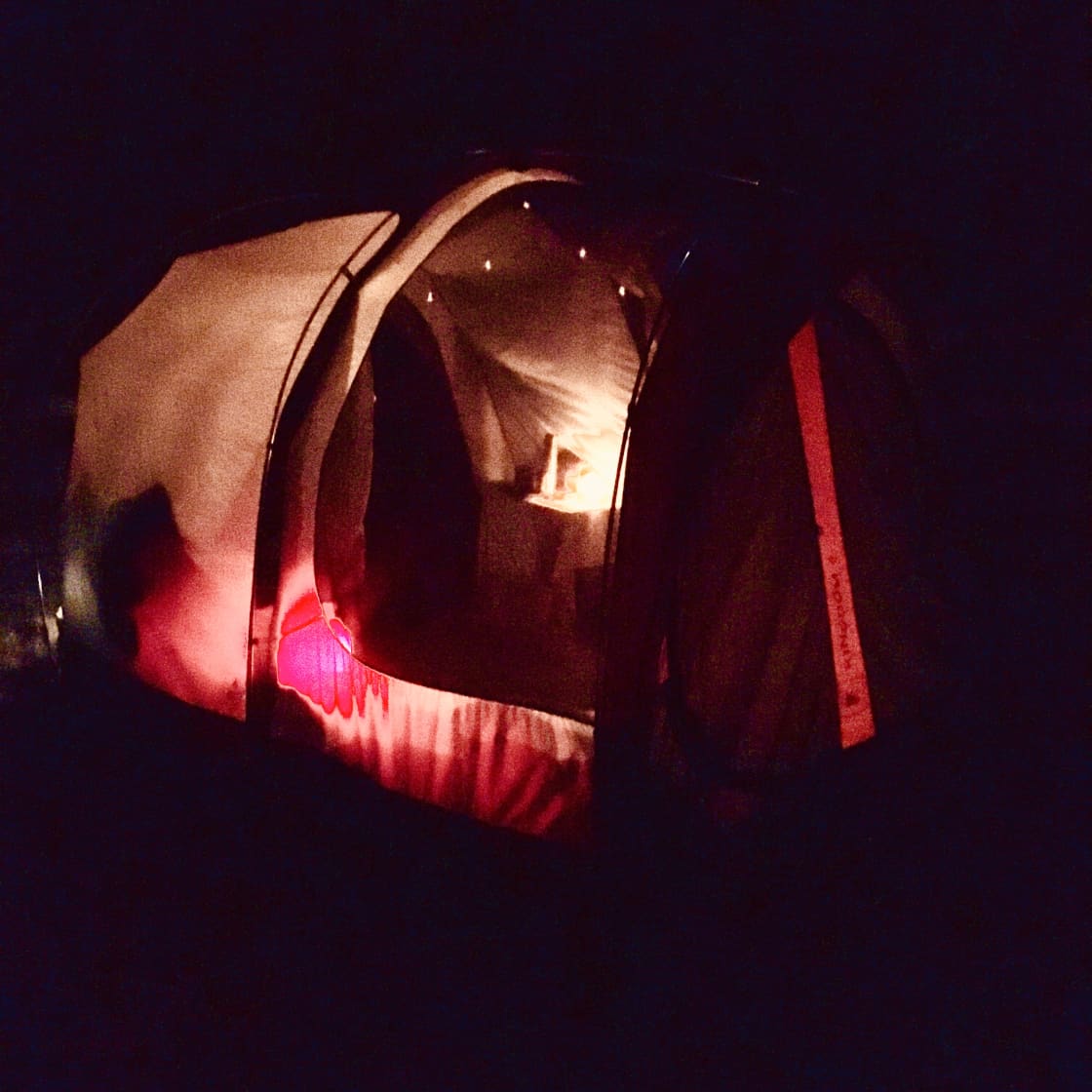 The actual Stargazer Tent - illuminated at night. 8 x 12 feet with two rooms and 6 1/2 foot ceiling.