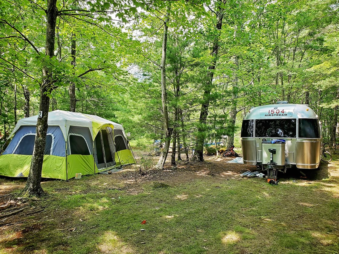 Large tent and 29 foot Airstream camper fit comfortably in site 2...4 adults and 3 children.