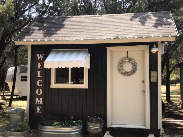This cute little Welcome Shed is the first thing you'll see as you turn into our property. Inside you'll find a Keurig coffee bar and full-size fridge where you are welcome to store a few of your perishables. Please note that this is a community space shared with other campsites.