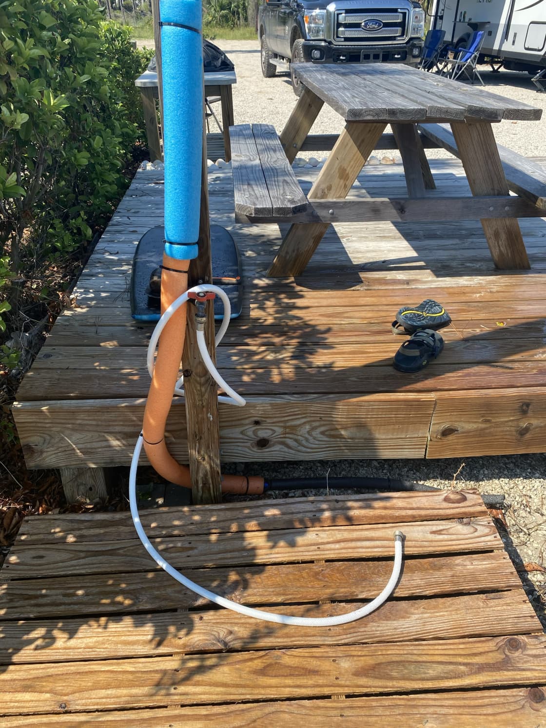 Outdoor shower plus hose for washing off sand and beach gear.