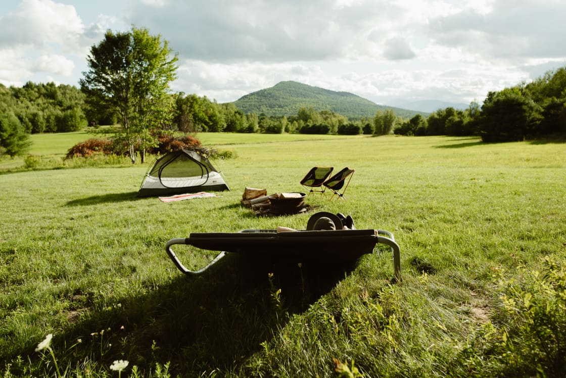 At this campsite location, you can watch the sunset behind the Adirondack mountains while lounging on a lounge bed!