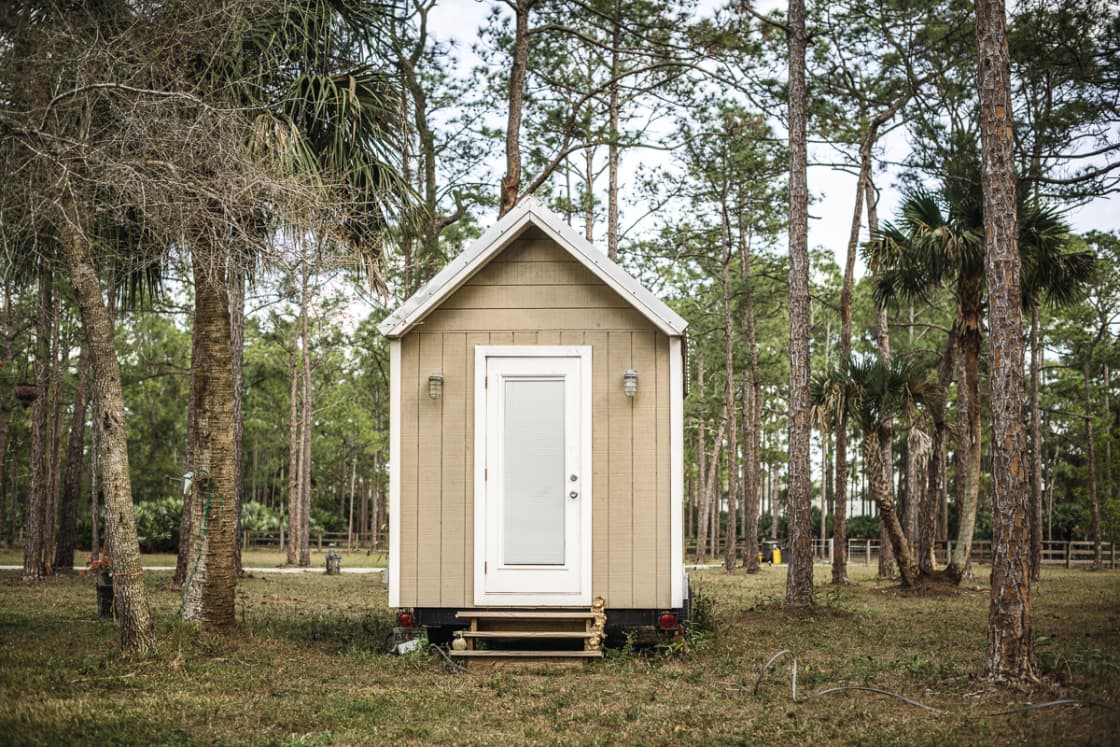 The tiny house where Vicky practices massage therapy and hypnosis is close to the bus