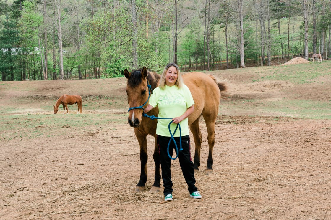 Cathy and one of her rescue horses