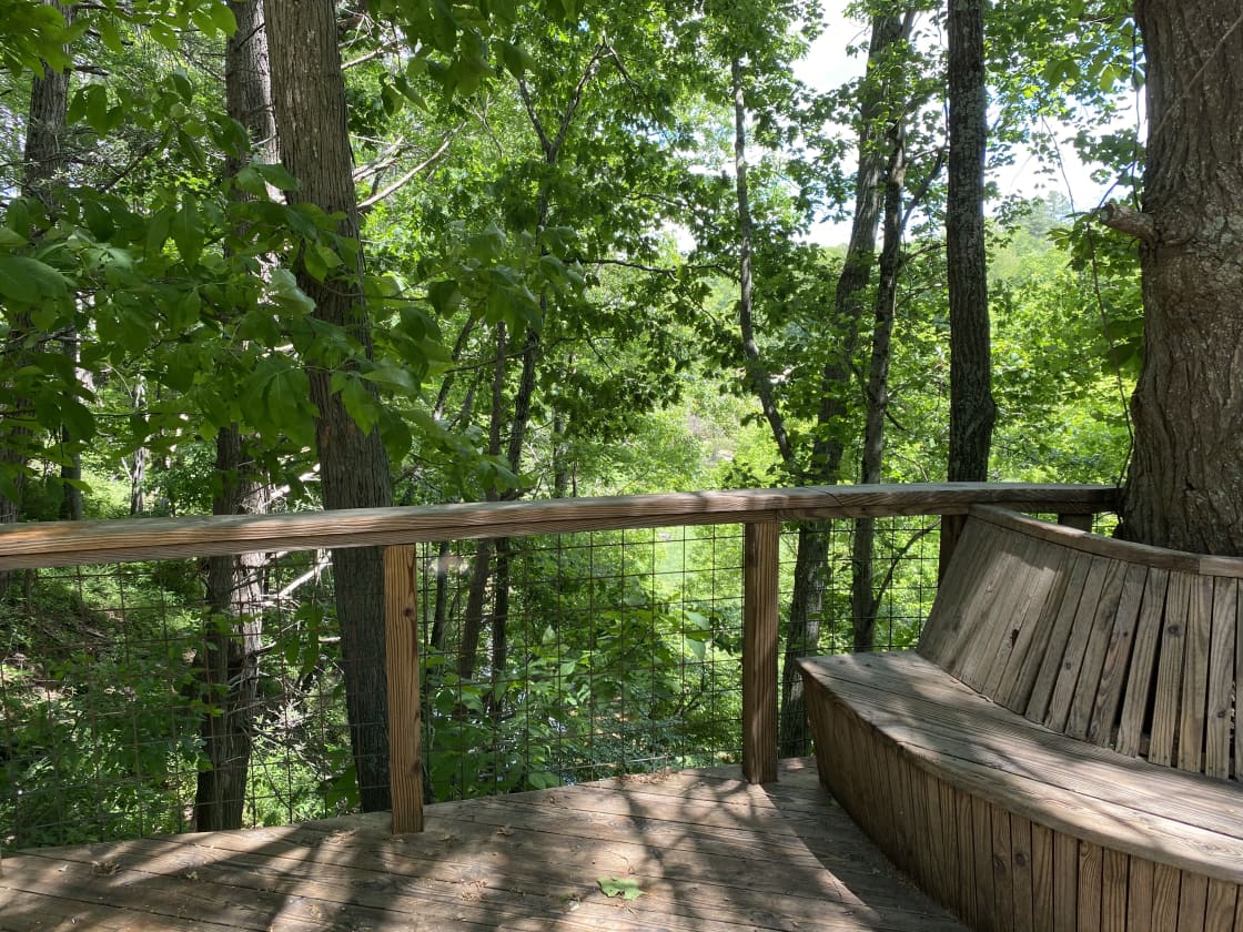 The deck overlooking the creek is right outside the cabin and yours to enjoy while you stay.