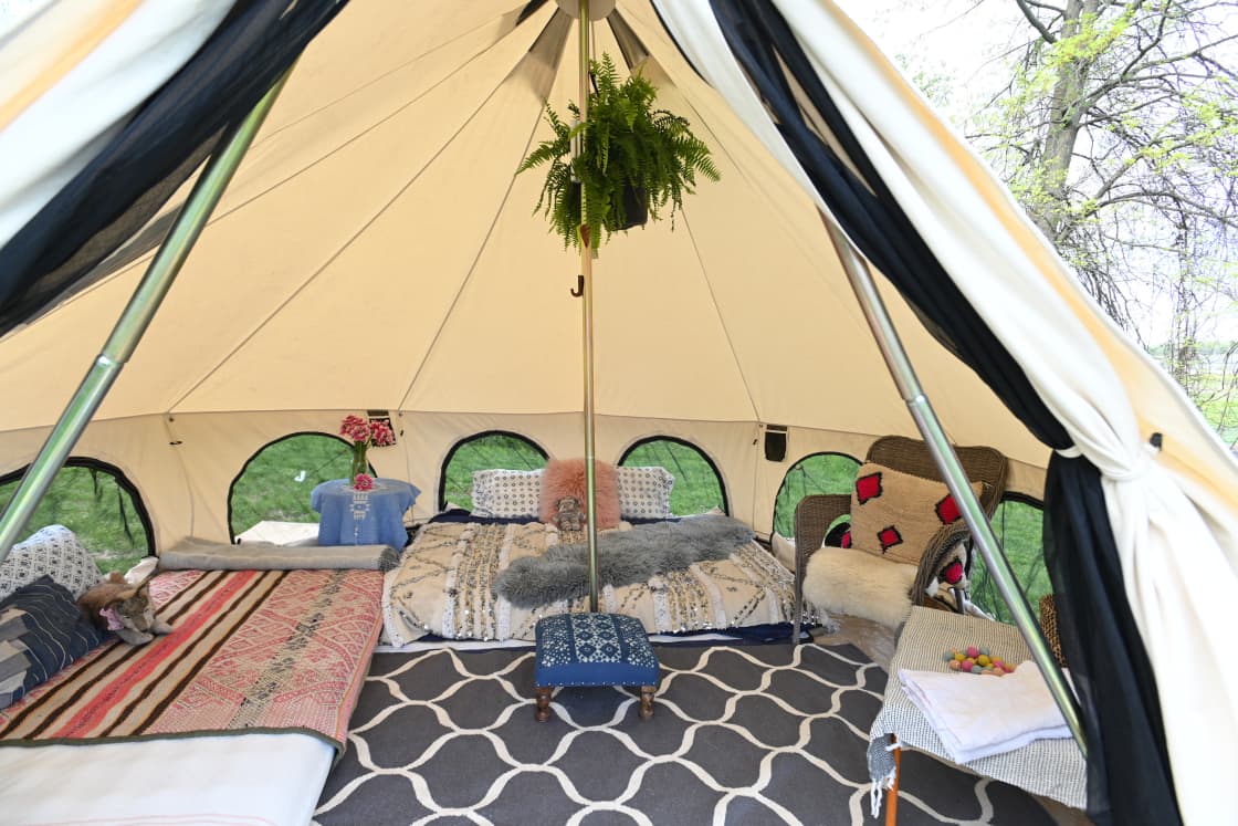 Bell Tent Site # 1 has a Full + a Twin mattress which comfortably accommodates 3 guests within. For an additional 2 guests, kindly either bring your own tent to pitch for $65/nt opt rent one from us. (note: interiors may differ slightly)
