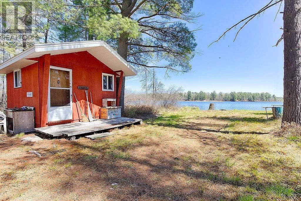 This is the "lake house" bunkie and view of the lake. This is a one room cabin with no amenities. 
