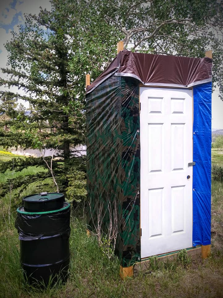 Work in progress port-a-potty, and bear resistant trash can
