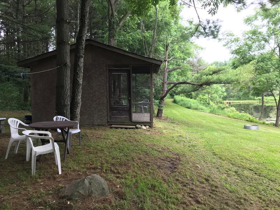 Private Forest by a Wildlife Pond - Your campsite & cabin on a cloudy day