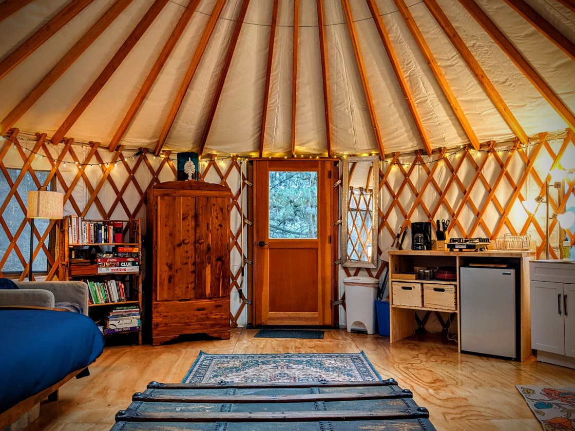 The fully furnished yurt experience, view from the couch.