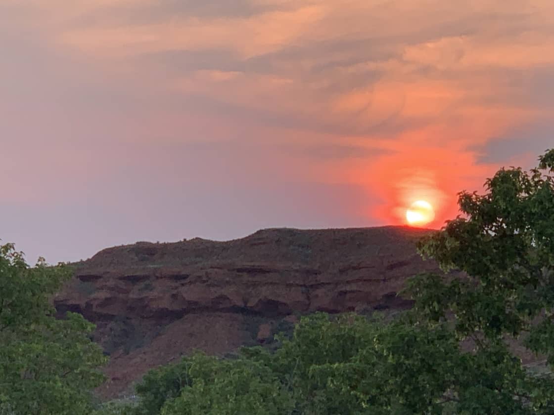 Summer is fire season and creates dynamic sunsets over the butte.