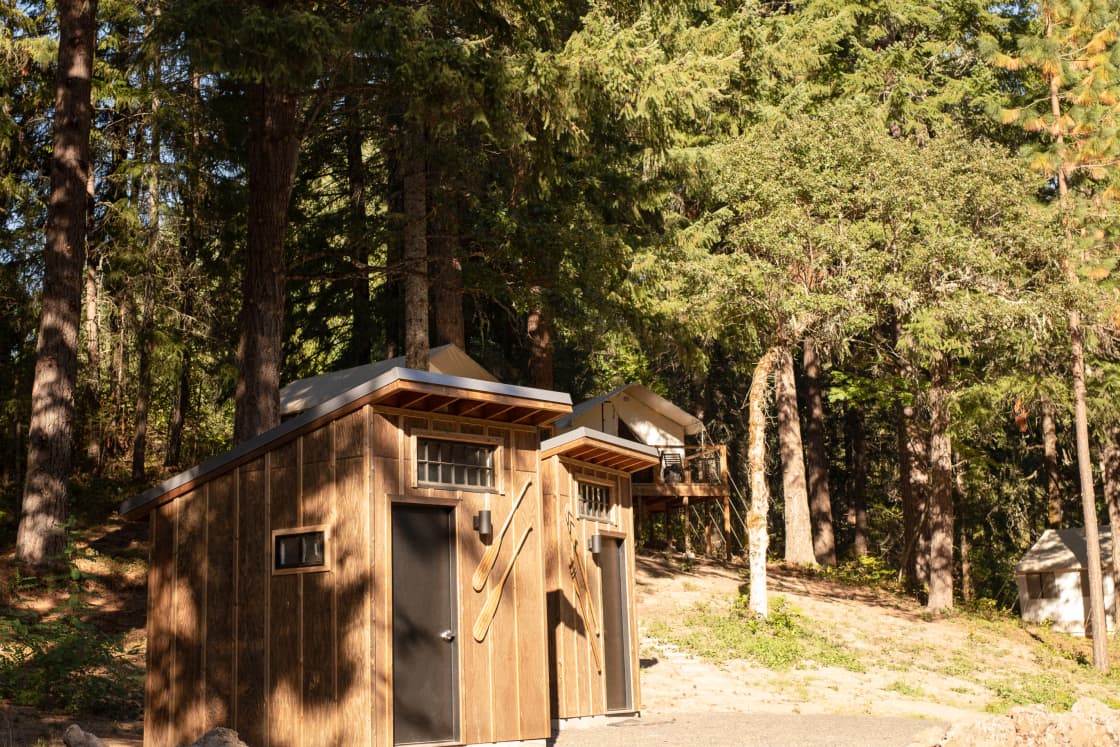 The two full bathrooms with the glamp sites in the back.