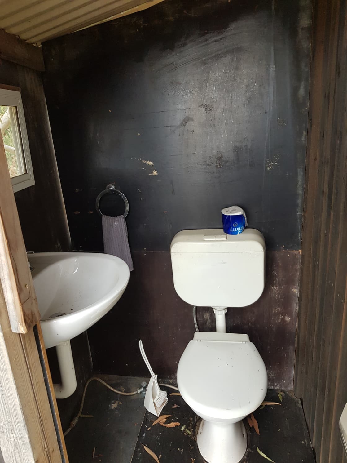 Toilet is outdoors and is very rudimentary, however serves the purpose with running water to wash your hands.