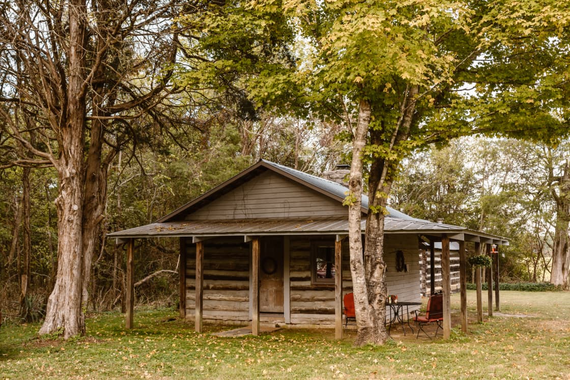 The cabin is nestled under some trees adjacent from the main property. There’s plenty of space for parking and privacy. 