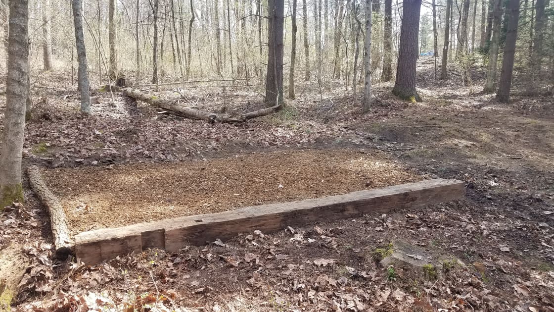 A freshly mulched tent pad 16' x 12'
