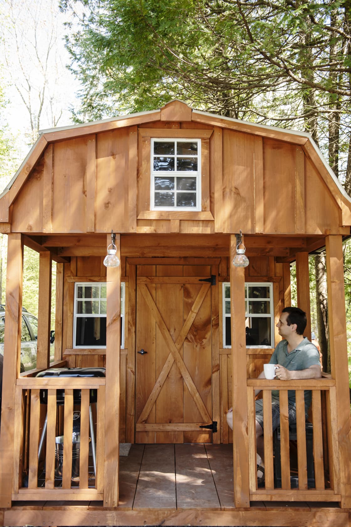 Front of the bunkie with a small porch and grill