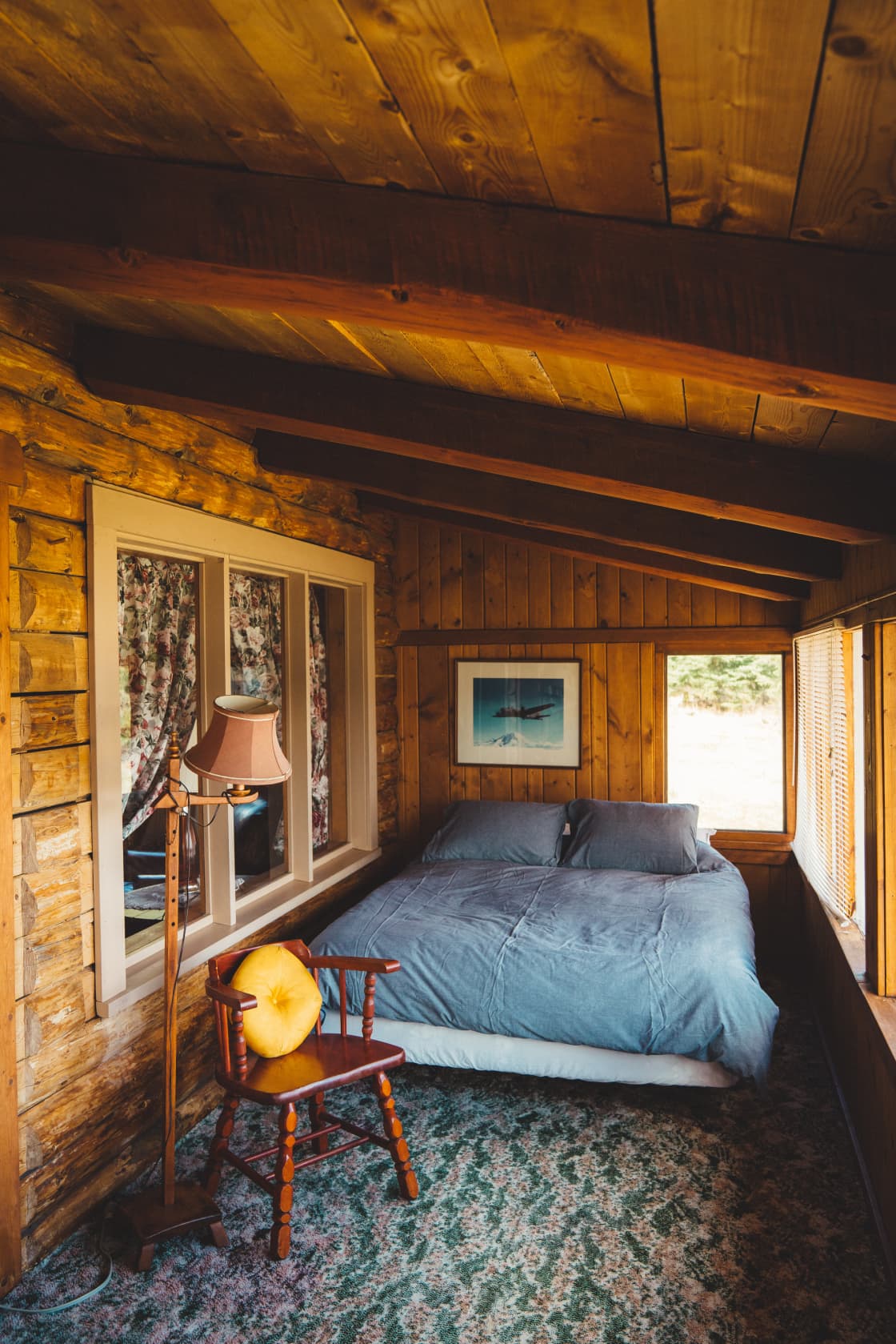 The larger bed within the cabin's bedroom. 