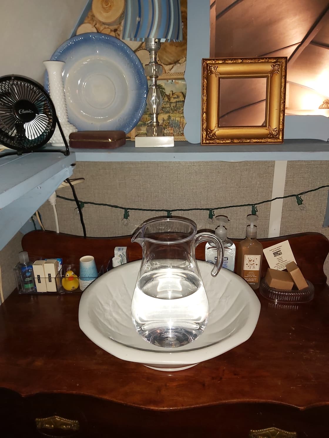 Freshen up by using this antique wash basin.  Water, soap, washcloths, and hand towels are provided.  You may also wash up in one of the fancy outhouses.